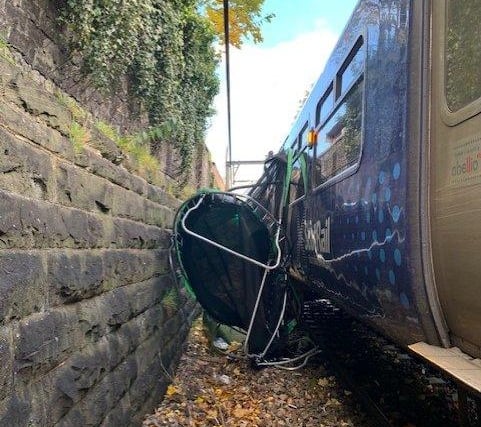 Advising customers to be aware of and stay safe in the windy conditions, ScotRail posted a picture of a trampoline blown onto the tracks and crushed by one of their trains in Scotland.