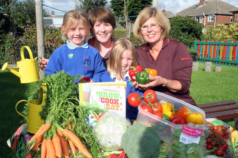 Pupils at Manor Infant School Brimington with their free growing kit from Sainsburys. pictured are pupils Charlie Evans 6 and Milissa Fielder, 5 with Andrea Embrey PR Ambassador for Sainsburys and Sally Craike food and community health advisor sainsburys Chesterfield