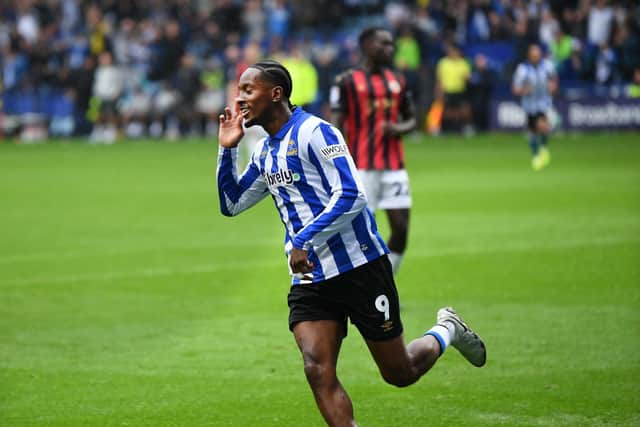 Jamal Lowe rescued Sheffield Wednesday against Huddersfield Town.