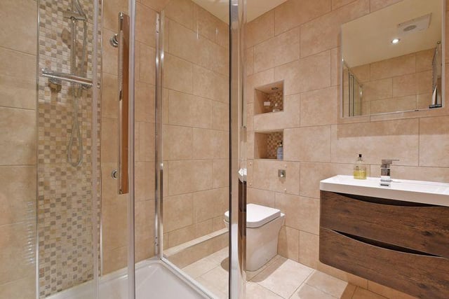 This is the en-suite - note the attractive recessed shelves in the walls.