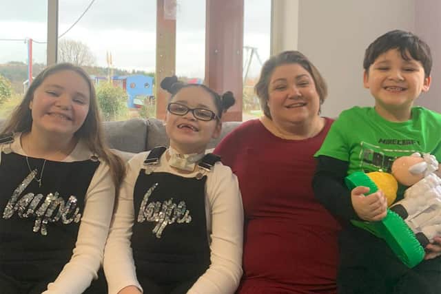 Sara Roberts and her three children Cordelia, 12; Sienna, 10; and Jareth, 5, at Bluebell Wood Children's Hospice