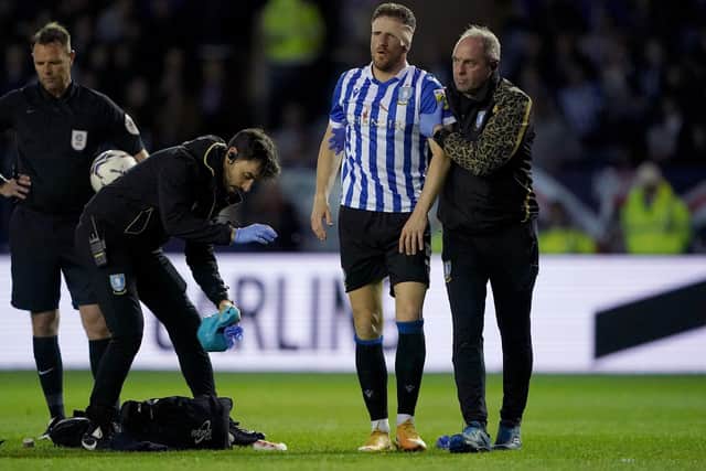 Sheffield Wednesday's Sam Hutchinson leaves the game with an injury during the Sky Bet League One play-off semi-final, second leg match at Hillsborough. Zac Goodwin/PA Wire.