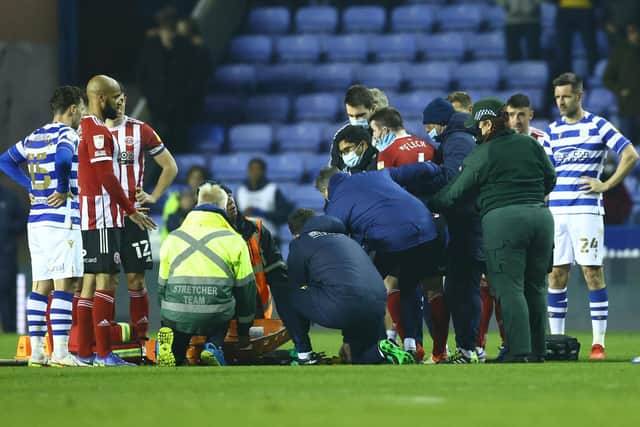 John Fleck of Sheffield United  attempts to stand before being stretchered off  during the game at Reading: David Klein / Sportimage