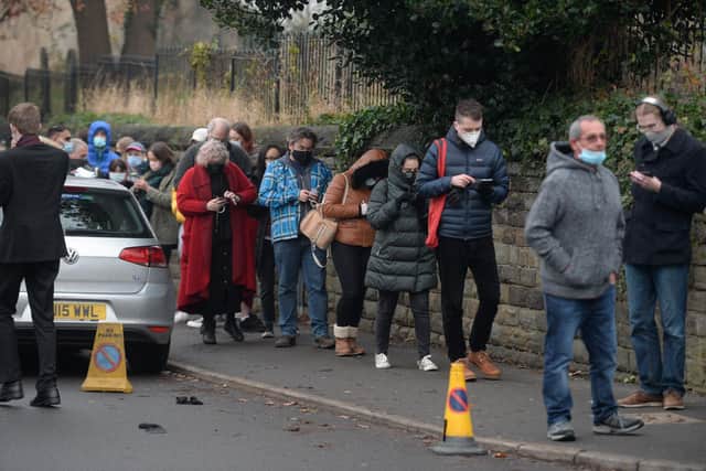 People queuing for their COVID-19 booster jab yesterday, Friday, at Heeley Church as the Omnicron variant rips through the British population - it's NOT open this weekend, though