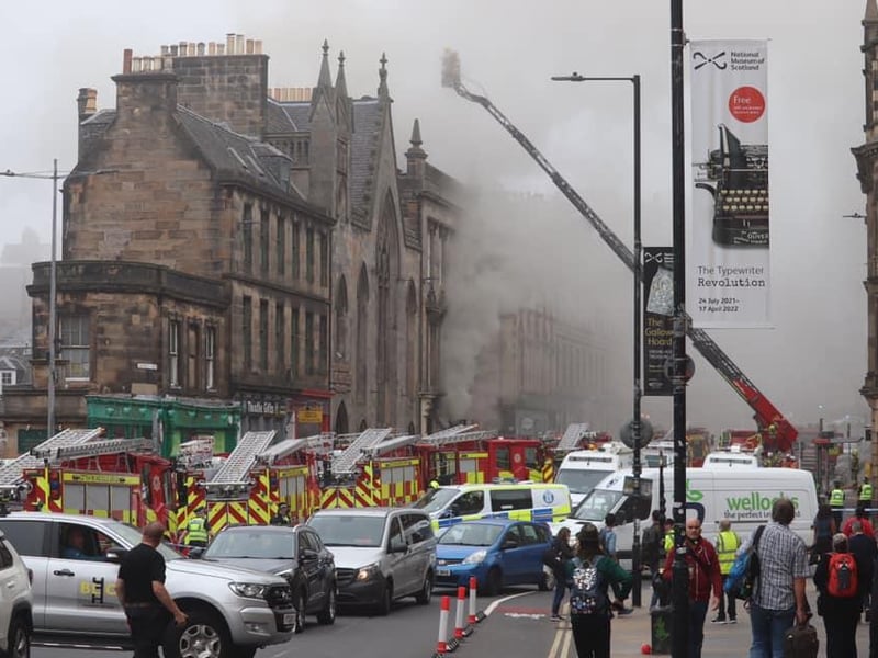 A large crowd has gathered while emergency services attend the incident.
