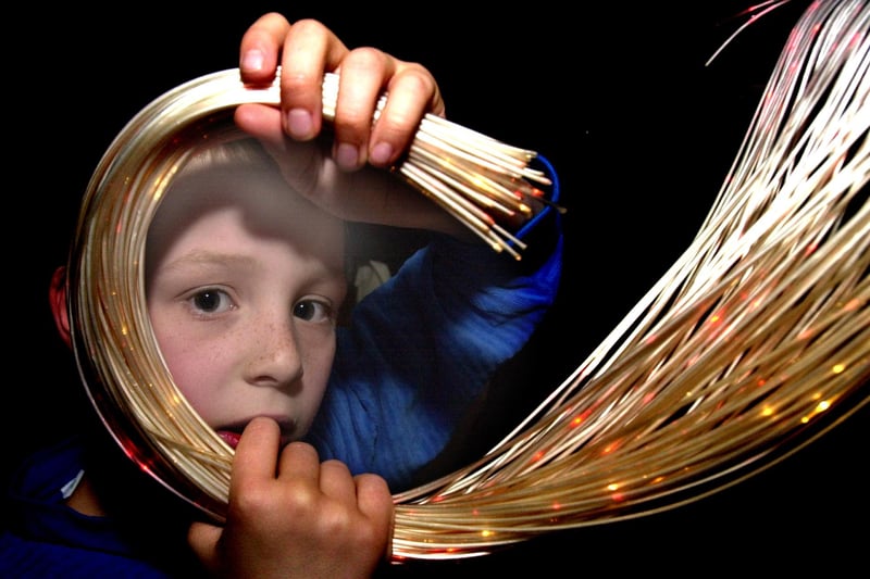 Pictured at the Kelham Island Museum, Alma Street, Sheffield. where Danny Capper 10 from Concord Junior school, Sheffield is seen with a bundle of fibre optics just one of the many science items on display for pupils as part of science week in March 2001