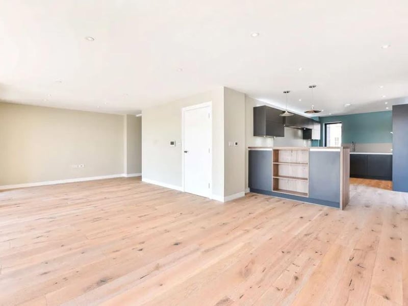 There is an open plan style living space and the kitchen which has luxury integrated appliances.