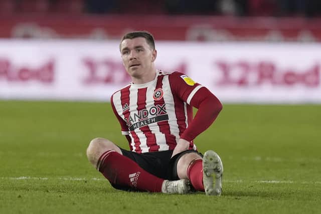 John Fleck of Sheffield United goes down injured against Middlesbrough: Andrew Yates / Sportimage