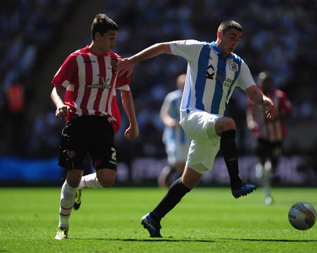 Kallum Higginbotham of Huddersfield Town battles with Matt Lowton of Sheffield United during the npower League One play-off final in 2012 (Jamie McDonald/Getty Images)
