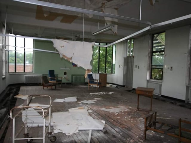 With discarded trolleys, beds and chairs, it's a sad sight for what would have been an impressive room. Do you recognise it?