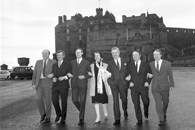 Scottish National party MPs Iain MacCormick, George Reid, Gordon Wilson, Winnie Ewing, Donald Stewart, Hamish Watt and Douglas Henderson on Edinburgh Castle esplanade in March 1974.