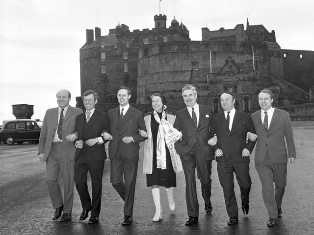 Scottish National party MPs Iain MacCormick, George Reid, Gordon Wilson, Winnie Ewing, Donald Stewart, Hamish Watt and Douglas Henderson on Edinburgh Castle esplanade in March 1974.