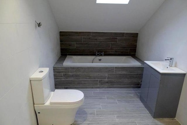 The family bathroom has a sky light.