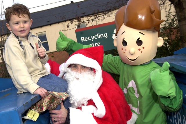 Father Christmas and Recyclit Rick are pictured at Safeway Supermarket, Infirmary Road, in 2002 to promote recycling over the festive period where they both meet four-year-old Josh Allison from Hillsborough