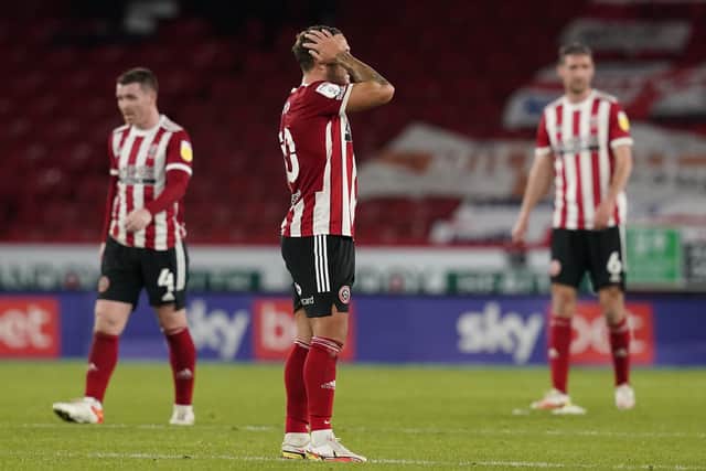 Billy Sharp of Sheffield United (centre) reacts after Millwall's second goal: Andrew Yates / Sportimage