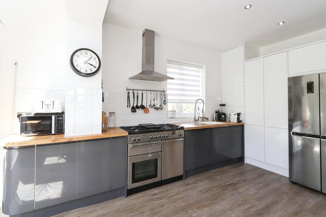 The full-width kitchen/family room has granite and solid oak worktops.