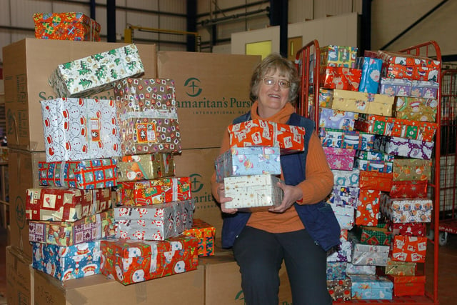 Madelaine McClintock with shoe boxes destined for India as part of Operation Christmas Child back in 2005