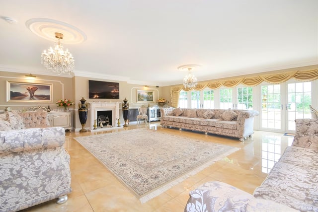 This huge five-bedroom Portsdown Hill home in Portsmouth is up for raffle. Pictured is its 8.71m x 8.15m drawing room.