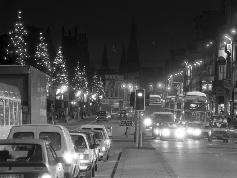 There were complaints from residents about the lack of Christmas lights and Christmas decorations in Edinburgh's Princes Street in December 1985. Picture of the Xmas trees lining the road, looking west.