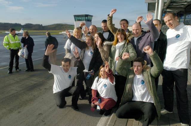 Employees at the O2 phone shop at Meadowhall pictured at Sheffield City Airport before their surprise helicopter flight to Wetherby racecourse in January 2005