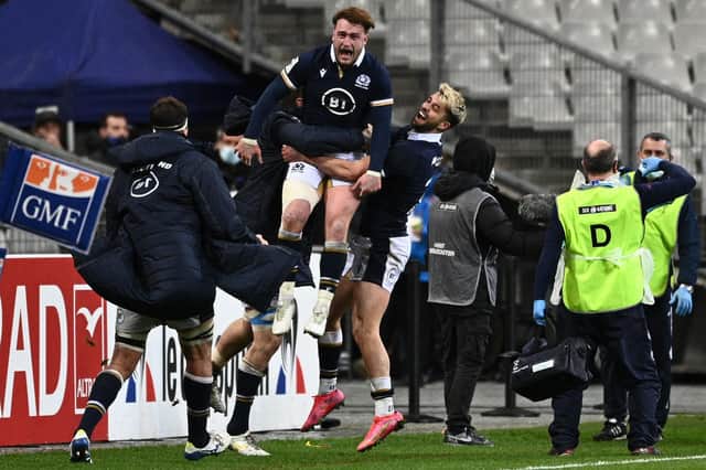 Scotland's Stuart Hogg celebrates with team-mates after beating France at the Stade de France in Saint-Denis, outside Paris. (Photo by Anne-Christine Poujoulat/AFP via Getty Images)
