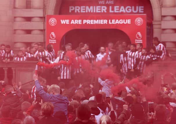 Sheffield United's players, staff and fans celebrate reaching the Premier League: Darren Staples/Sportimage