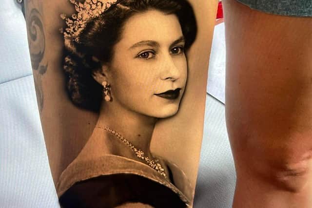 Amazing portrait of the late Queen Elizabeth II tattooed on the right thigh of Falon Cooper. See SWNS story SWSMtatto; A woman has had an amazing remembrance portrait of 'our most treasured' Queen Elizabeth II tattooed on her leg. 