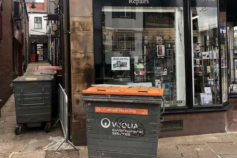 The frustrated snapper of this picture says the bins are left there "every other morning" - blocking the the display and causing a "nuisance" for pedestrians