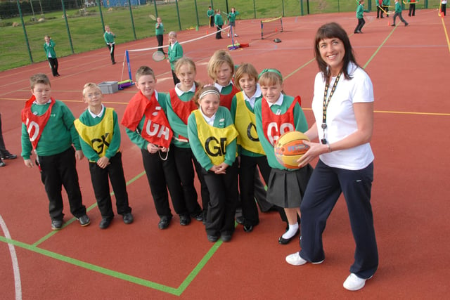 Teaching assistant Fiona Walton gets games underway in one of the new play areas at Murton Community Primary School. Remember this from 2009?