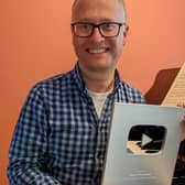 Stephen Wiles holding his Silver YouTube Creators Award. The Sheffield High School teacher is also a fellow at the Incorporated Society of Musicians