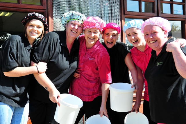 Liberty staff get ready for their ice bucket challenge in 2014.
