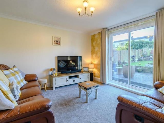 Sliding patio doors, leading out on to the back garden, are a feature of the bright lounge. The room, which also has a radiator and coving to the ceiling, is ideal for relaxing in front of the TV.