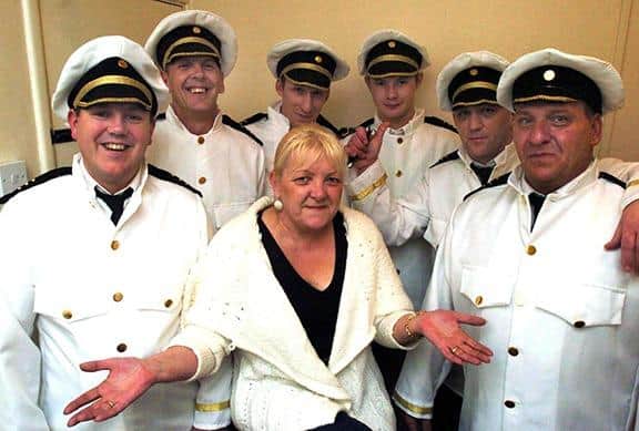 Pictured at the Penguin Pub, Mason Lathe Road, Shiregreen, Sheffield, where a charity event was held to raise money for the Harvey Phillips Trust. Seen is landlady Lesley Tuckwood with six of her locals who were performing a Full Monty at the event. Included in the line up were, Mark Bell, Lance Wood, Andrew Woods, Dennis Kelk, Neil Cooper and Steve Rimmigton, on April 13, 2006