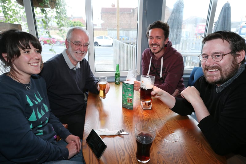 From left, Sarah Crispin, Richard Crispin, Michael Crispin and Darren Ford. Fans watch England v Czech Reublic in England's third Group D game of Euro 2020, in The Star & Garter pub, Copnor, Portsmouth. Picture: Chris Moorhouse (jpns 220621-17)
