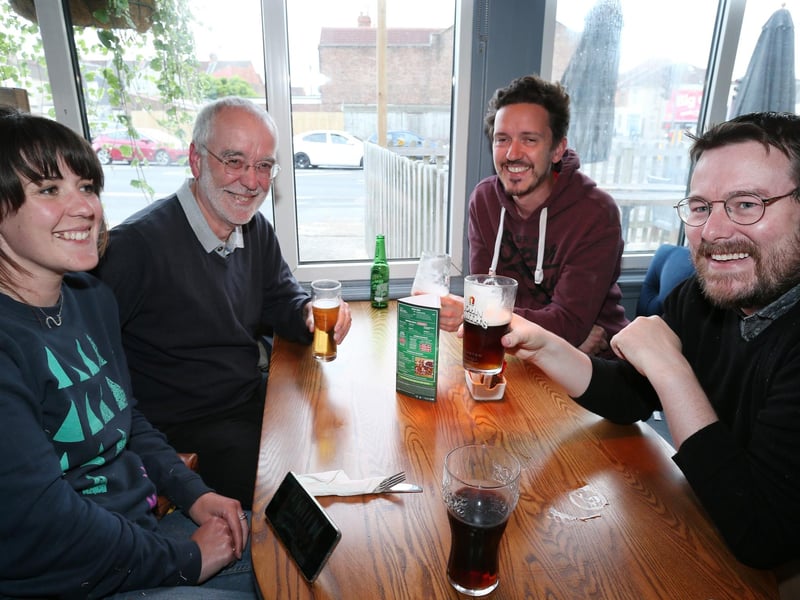 From left, Sarah Crispin, Richard Crispin, Michael Crispin and Darren Ford. Fans watch England v Czech Reublic in England's third Group D game of Euro 2020, in The Star & Garter pub, Copnor, Portsmouth. Picture: Chris Moorhouse (jpns 220621-17)