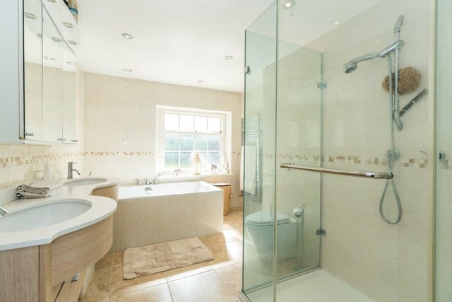 The property features four bathrooms, including a large family bathroom which comprises a walk-in shower, large bath, toilet and dual sinks.
