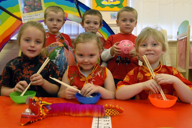 Reception class pupils were celebrating the Chinese New Year in this scene from 13 years ago.