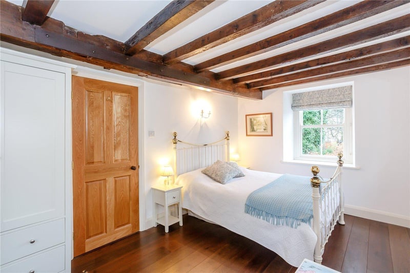 There are timber beams overhead in many rooms.