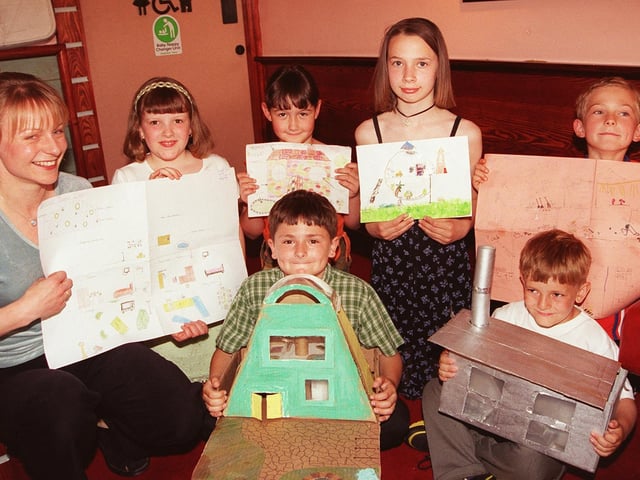 Pictured at the Deep Pan Pizza Restaurant, Crystal Peaks, in 1999 where winners in the Design a Dream House competition receiving their awards and a meal at the restaurant. The competition was run by Civil Engineering company Anthony Hunt Associates. Seen is Catherine Hodson. who presented the prizes. with the winners