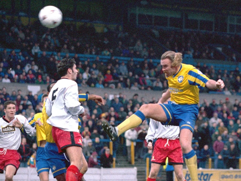 The legendary Kevin 'Killer' Kilcline gets a header away against Cardiff.