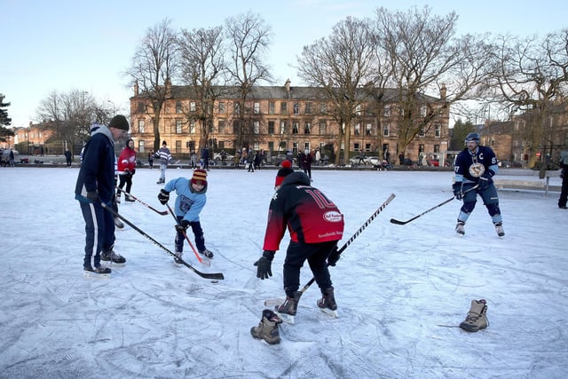 People play a game of ice hockey on a frozen pond in Queen's Park in Glasgow. Picture: Andrew Milligan/PA Wire