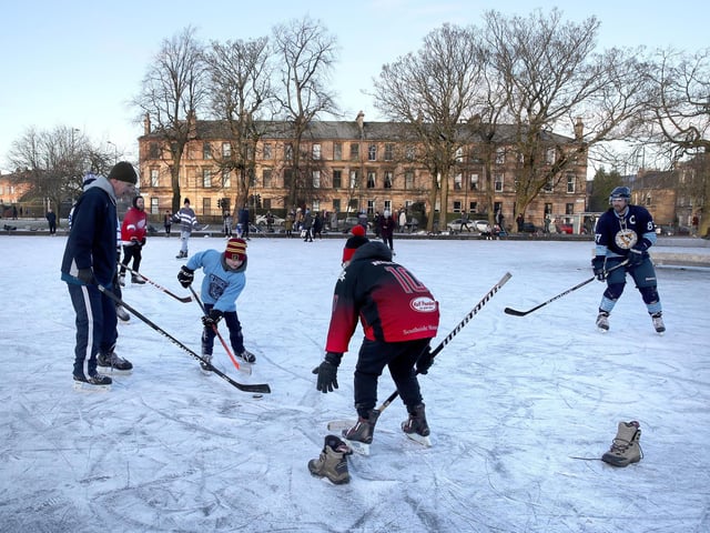 People play a game of ice hockey on a frozen pond in Queen's Park in Glasgow. Picture: Andrew Milligan/PA Wire
