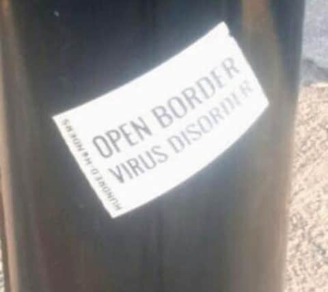Two men in their 20s have been arrested by South Yorkshire Police in connection with stickers posted across Sheffield that link migration with the coronavirus pandemic.