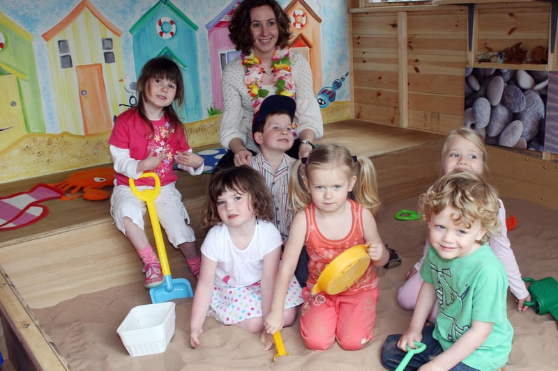 Youngstrrs try out the new play buildings at Little Scholars Nursery, in Newbold. Pictured are mural designer Joanne Wales with children L-R, Orla Conneely, Maddie Smith, Diarmuid Wales, Sarah Hind, Chantelle Le Galez and Patrick Diamond.