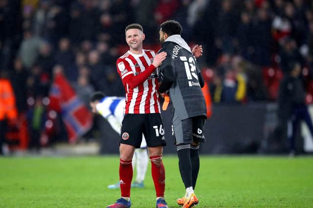 Sheffield United's Oliver Norwood (left) hugs goalkeeper Wes Foderingham after victory over QPR: Isaac Parkin/PA Wire.