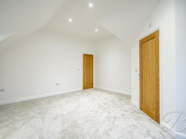 The bedroom is 8'11" by 13'4" and has an en-suite.