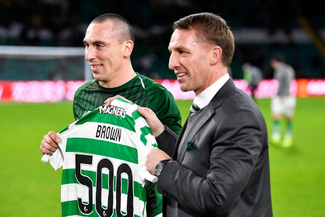 Brown (left) with former Celtic manager Brendan Rodgers as he prepares to play his 500th match for the club. Rodgers has since invited his former player to spend time with him at Leicester City