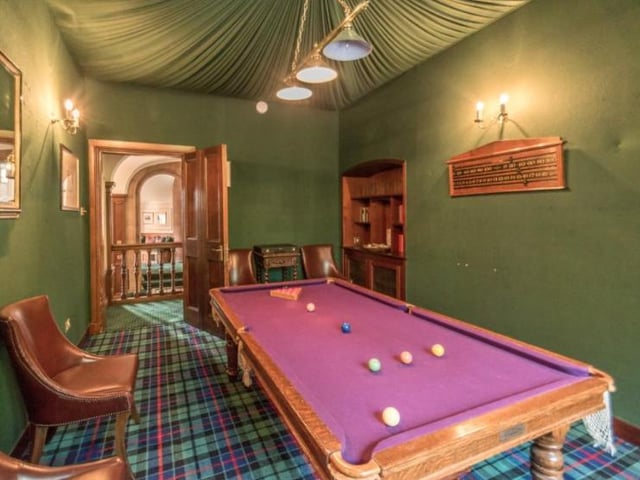 The games room has two open display presses, tartan flooring and a snooker table to keep you entertained