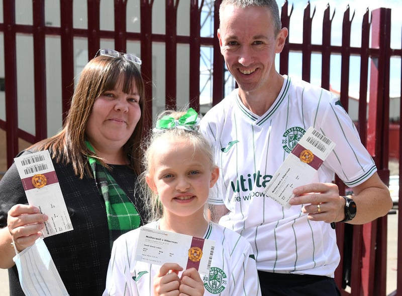 Happy Hibs fans pose with their match tickets ahead of kick-off against Motherwell