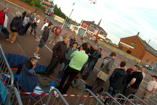 Bruce Springsteen fans queuing to get a prime position for the concert.